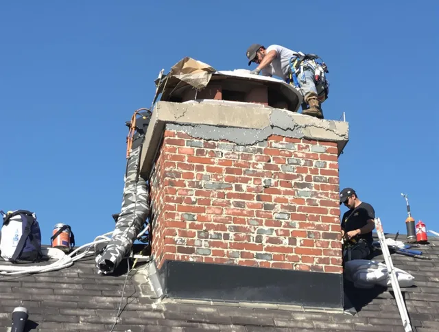 Huntington Park Chimney Sweep installing a custom chimney crown in Huntington Park, CA