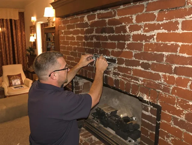 Huntington Park Chimney Sweep expert fixing a fireplace in Huntington Park, CA